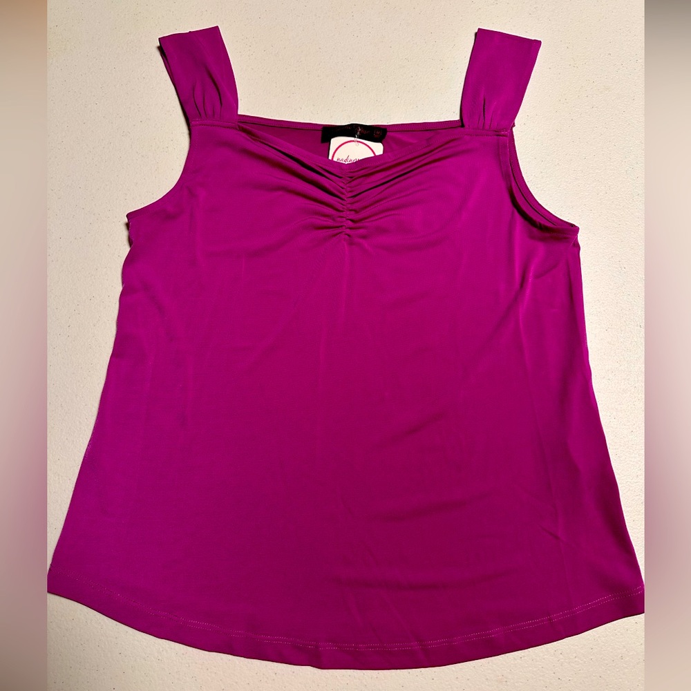 Never worn tank top. Still has tags. Size medium